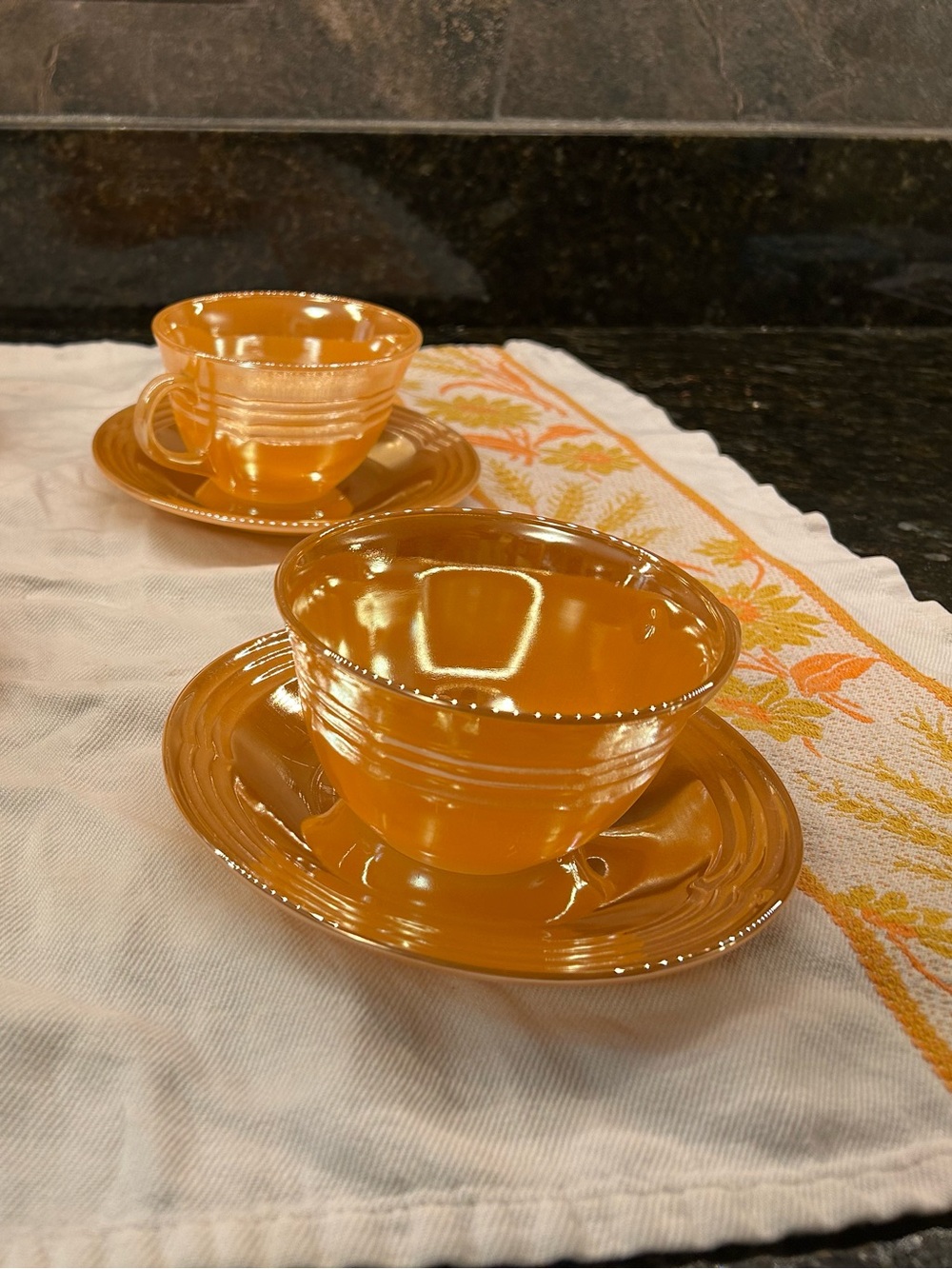 Fire King Peach Luster tea cups and saucers